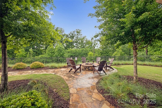 528 Rock Skip Way, Fort Mill, SC 29708 - view of patio / terrace with an outdoor fire pit and view of wooded area