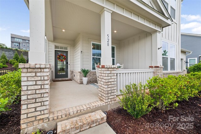 528 Rock Skip Way, Fort Mill, SC 29708 - entrance to property featuring a porch and board and batten siding