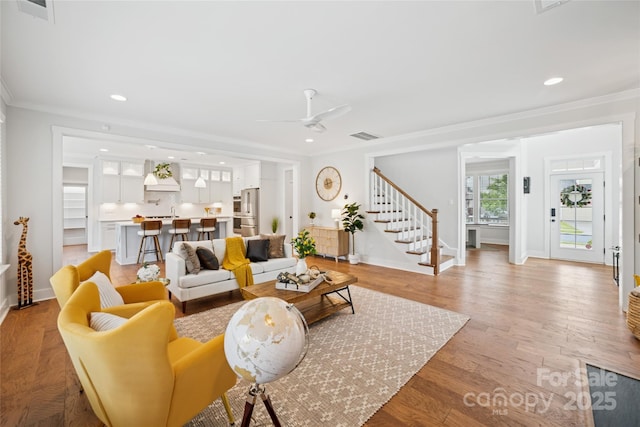 528 Rock Skip Way, Fort Mill, SC 29708 - living room featuring stairway, ornamental molding, recessed lighting, ceiling fan, and light wood-style floors