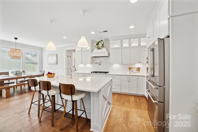 528 Rock Skip Way, Fort Mill, SC 29708 - kitchen featuring high end refrigerator, premium range hood, gas stovetop, white cabinets, and recessed lighting