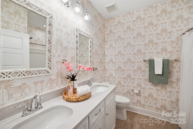 528 Rock Skip Way, Fort Mill, SC 29708 - full bathroom with wood finished floors, double vanity, and wallpapered walls