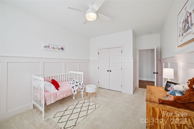 528 Rock Skip Way, Fort Mill, SC 29708 - carpeted bedroom with a closet, a decorative wall, ceiling fan, and wainscoting