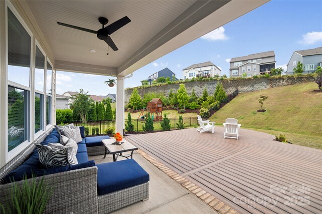 528 Rock Skip Way, Fort Mill, SC 29708 - fenced backyard featuring an outdoor living space, a residential view, a playground, ceiling fan, and a wooden deck