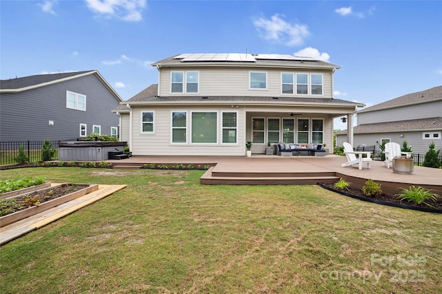 528 Rock Skip Way, Fort Mill, SC 29708 - back of property with a hot tub, outdoor lounge area, roof mounted solar panels, a deck, and a ceiling fan