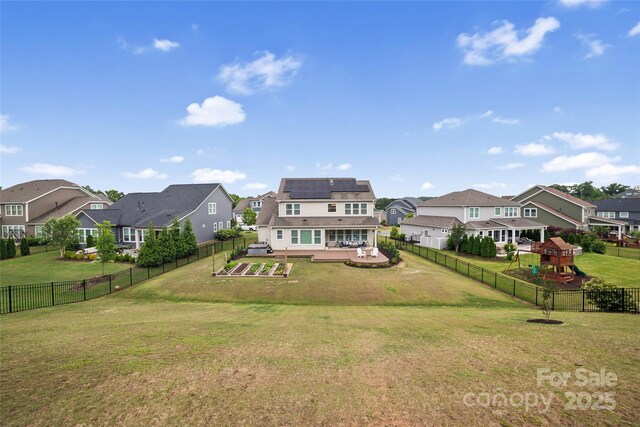 528 Rock Skip Way, Fort Mill, SC 29708 - rear view of house featuring a residential view, solar panels, and a fenced backyard