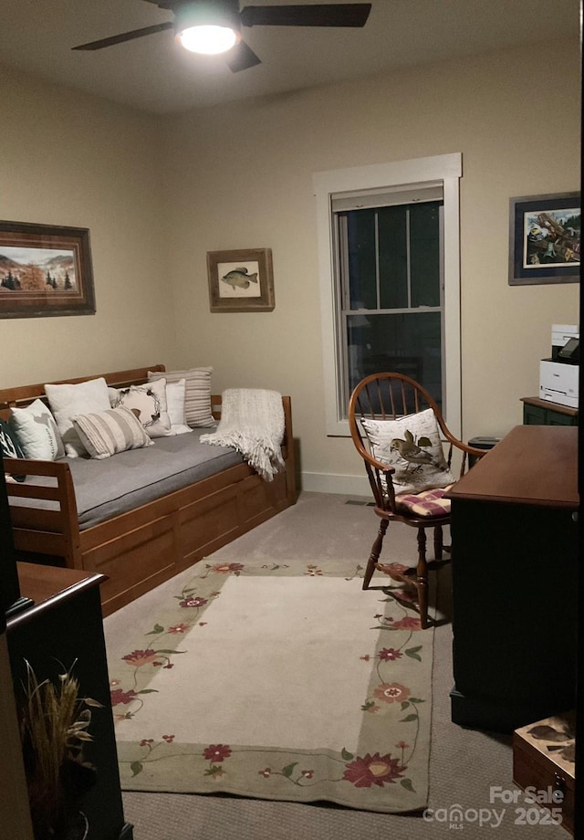 carpeted bedroom featuring a ceiling fan