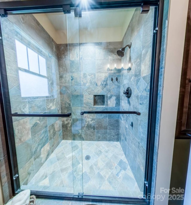 full bath featuring a shower stall