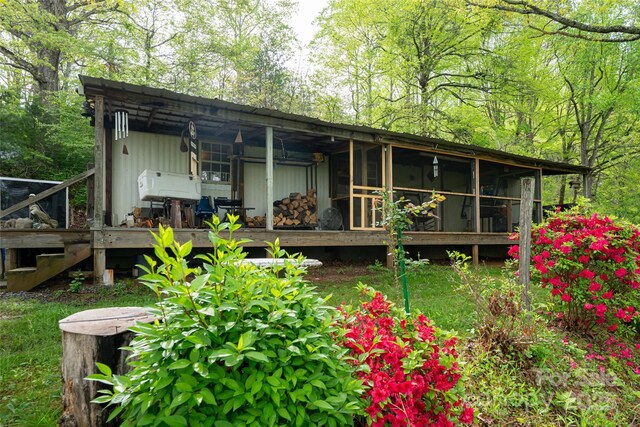 back of property with a wooden deck