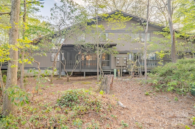 rear view of property with a sunroom