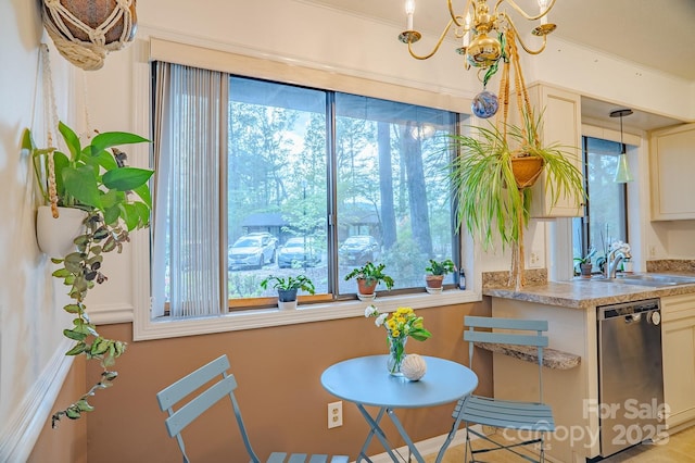 dining room with plenty of natural light and a notable chandelier