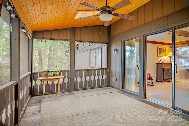 unfurnished sunroom with ceiling fan and a wealth of natural light
