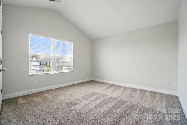 4321 Hornyak Dr, Monroe, NC 28110 - empty room featuring carpet flooring, lofted ceiling, and baseboards