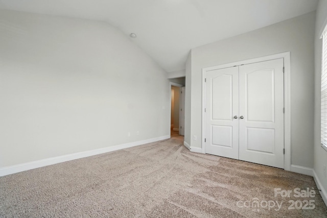 4321 Hornyak Dr, Monroe, NC 28110 - unfurnished bedroom featuring carpet floors, vaulted ceiling, baseboards, and a closet