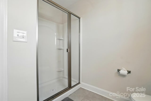 4321 Hornyak Dr, Monroe, NC 28110 - full bath featuring a stall shower, tile patterned floors, toilet, and baseboards