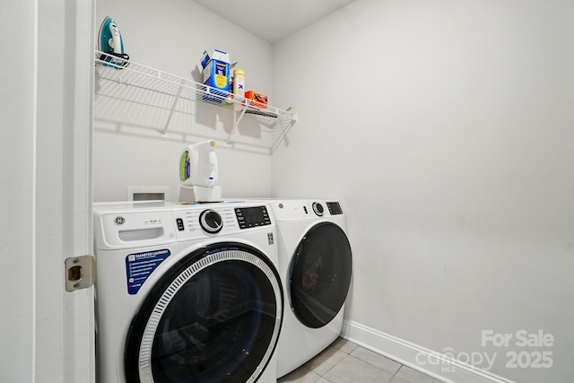 4321 Hornyak Dr, Monroe, NC 28110 - laundry room with washing machine and dryer, baseboards, and light tile patterned floors