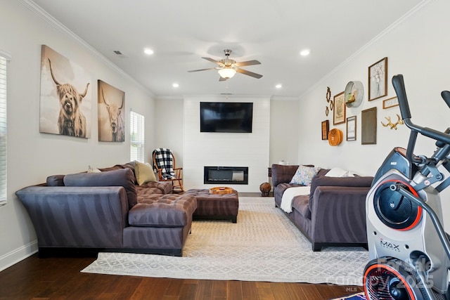 4321 Hornyak Dr, Monroe, NC 28110 - living room with crown molding, ceiling fan, hardwood / wood-style flooring, a large fireplace, and recessed lighting