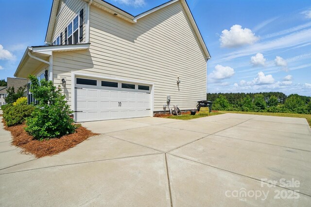 4321 Hornyak Dr, Monroe, NC 28110 - view of home's exterior featuring concrete driveway and a garage