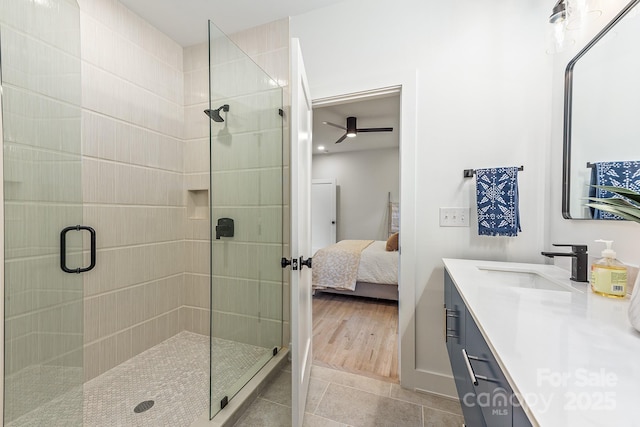 1847 Vinton St, Charlotte, NC 28216 - full bath with tile patterned flooring, a shower stall, ceiling fan, vanity, and connected bathroom