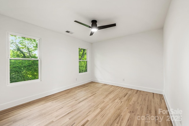 1847 Vinton St, Charlotte, NC 28216 - spare room with baseboards, a ceiling fan, light wood-style floors, and visible vents