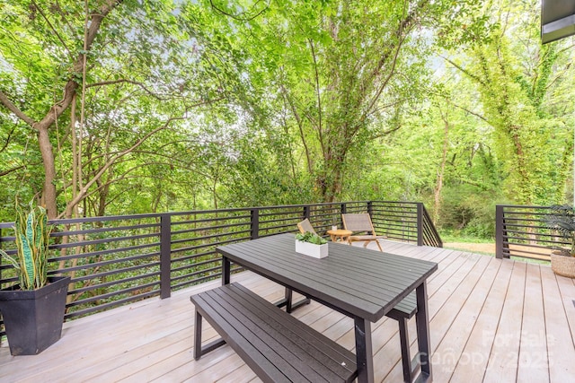 1847 Vinton St, Charlotte, NC 28216 - wooden deck featuring a forest view and outdoor dining space