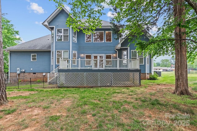 back of house with a lawn, fence, a deck, and crawl space