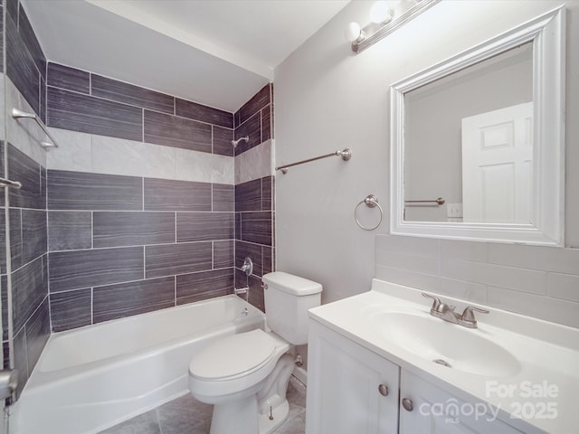 full bath with vanity, toilet, backsplash, tile patterned flooring, and shower / washtub combination