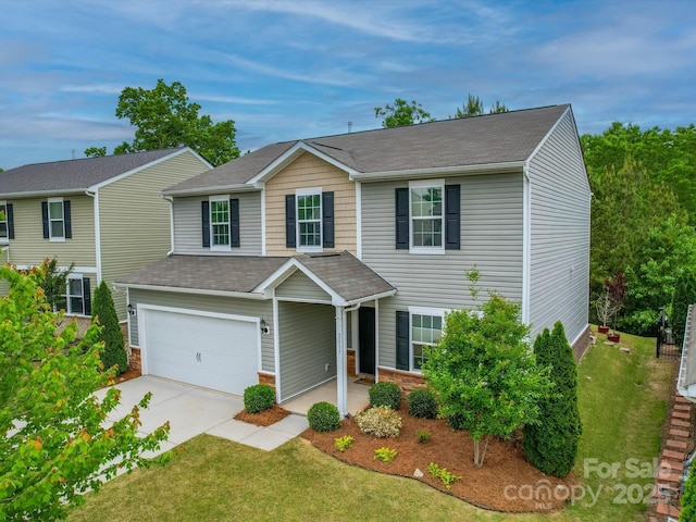 traditional-style house with a garage, a shingled roof, concrete driveway, and a front lawn