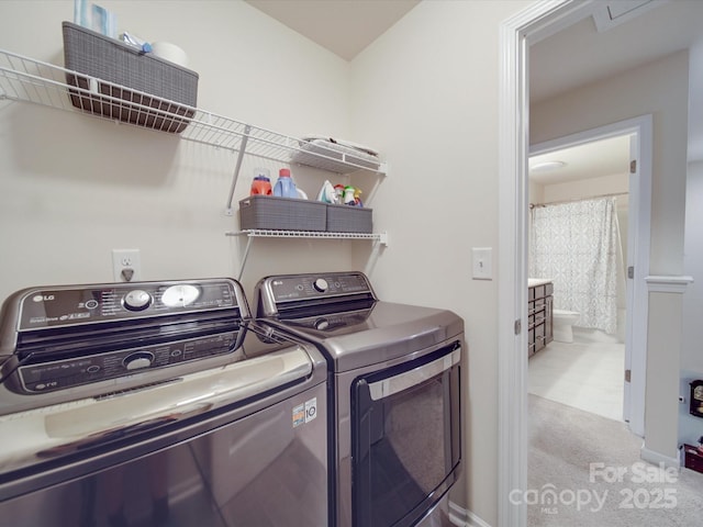 laundry area with laundry area, carpet flooring, and washing machine and dryer