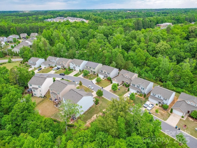 aerial view featuring a residential view and a view of trees