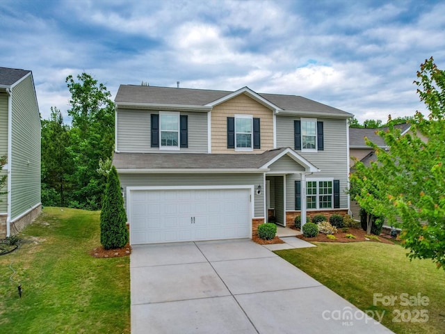 view of front of house with a garage, driveway, and a front lawn