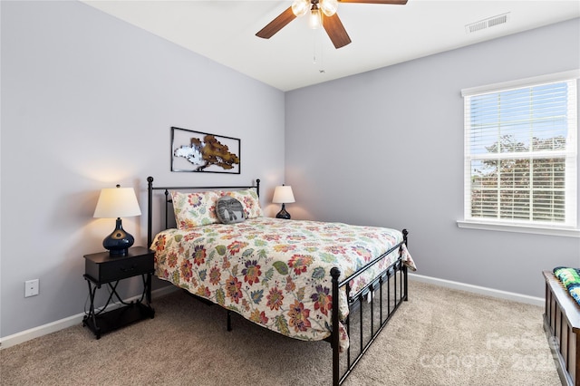 bedroom with visible vents, carpet, ceiling fan, and baseboards