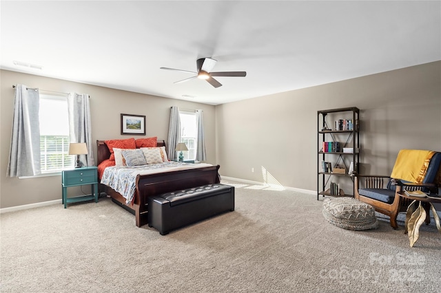 bedroom with visible vents, baseboards, carpet floors, and ceiling fan