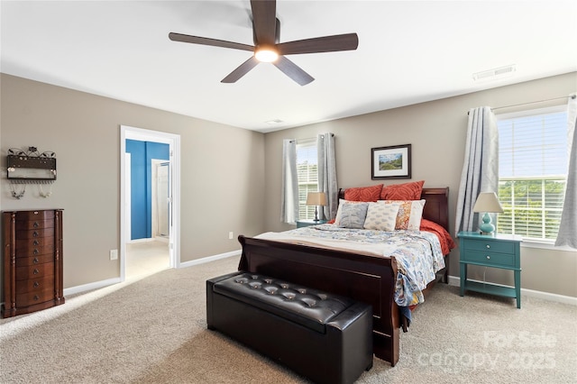 bedroom with carpet flooring, a ceiling fan, baseboards, and visible vents