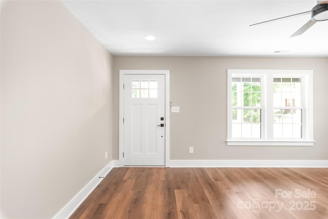 640 Central Dr NW, Concord, NC 28027 - foyer entrance with a healthy amount of sunlight, baseboards, and wood finished floors