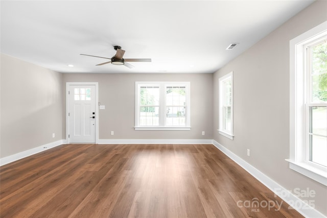 640 Central Dr NW, Concord, NC 28027 - unfurnished living room with baseboards, a ceiling fan, recessed lighting, and wood finished floors