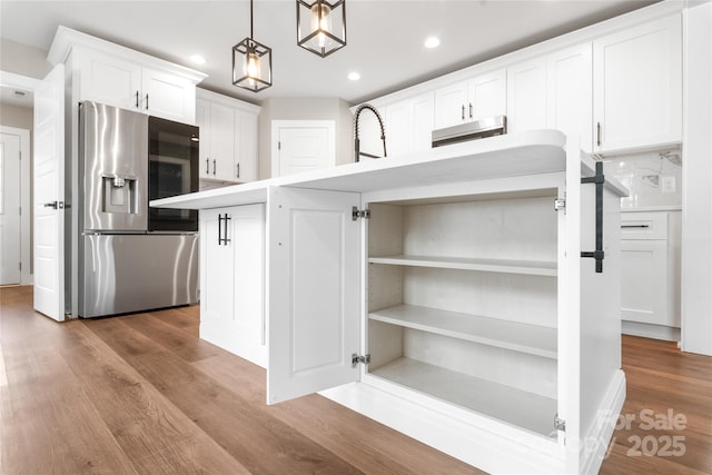 640 Central Dr NW, Concord, NC 28027 - kitchen featuring white cabinets, stainless steel fridge, light countertops, recessed lighting, and wood finished floors