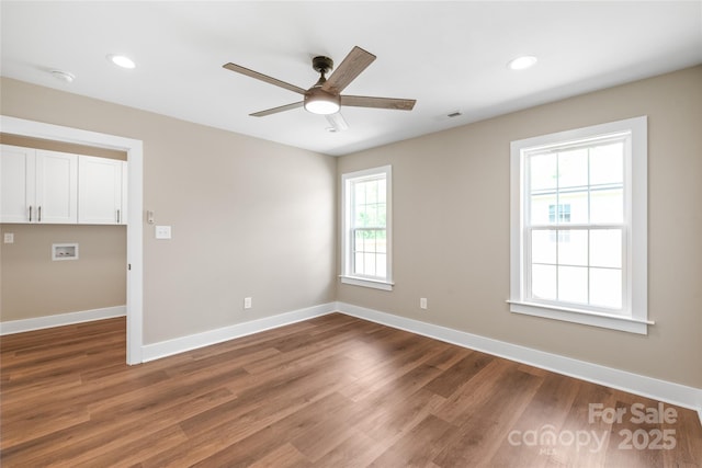 640 Central Dr NW, Concord, NC 28027 - unfurnished room with baseboards, ceiling fan, wood finished floors, and visible vents