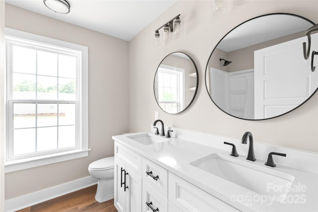 640 Central Dr NW, Concord, NC 28027 - full bathroom with a sink, a wealth of natural light, and toilet