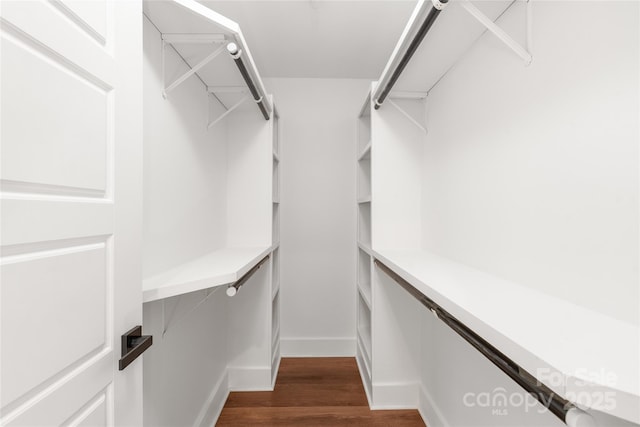 640 Central Dr NW, Concord, NC 28027 - walk in closet featuring dark wood-type flooring