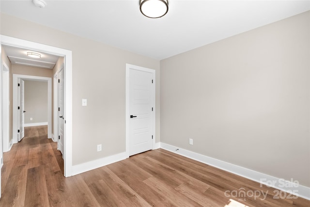 640 Central Dr NW, Concord, NC 28027 - unfurnished bedroom with baseboards and wood finished floors