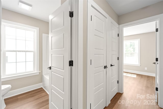 640 Central Dr NW, Concord, NC 28027 - hallway with baseboards and light wood-style flooring