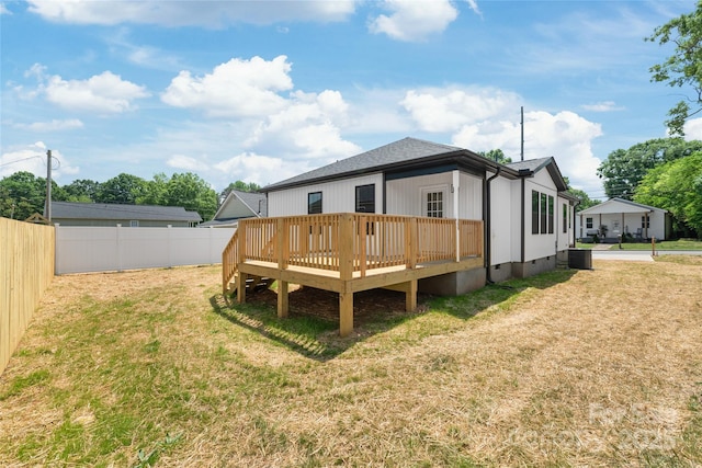 640 Central Dr NW, Concord, NC 28027 - back of property featuring a deck, crawl space, a fenced backyard, central air condition unit, and a yard