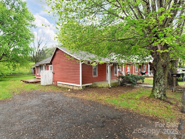 view of side of property with a porch