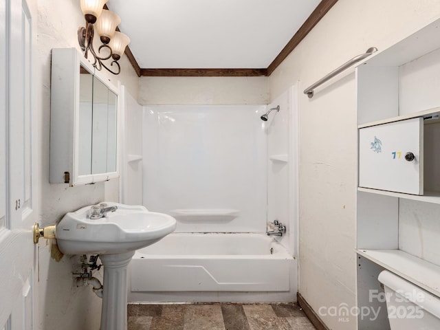bathroom with bathtub / shower combination and toilet