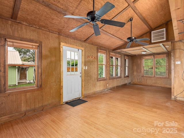 unfurnished sunroom with plenty of natural light and visible vents