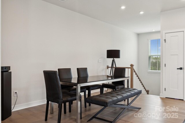 dining space featuring recessed lighting, wood finished floors, and baseboards