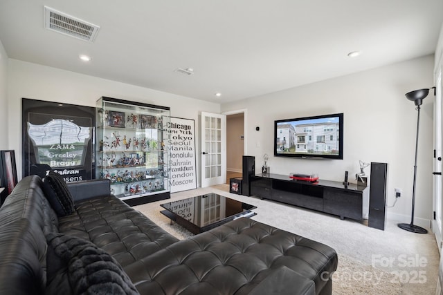 living room featuring visible vents, recessed lighting, carpet flooring, and baseboards
