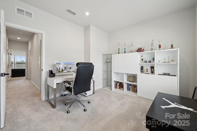 carpeted office with visible vents and recessed lighting