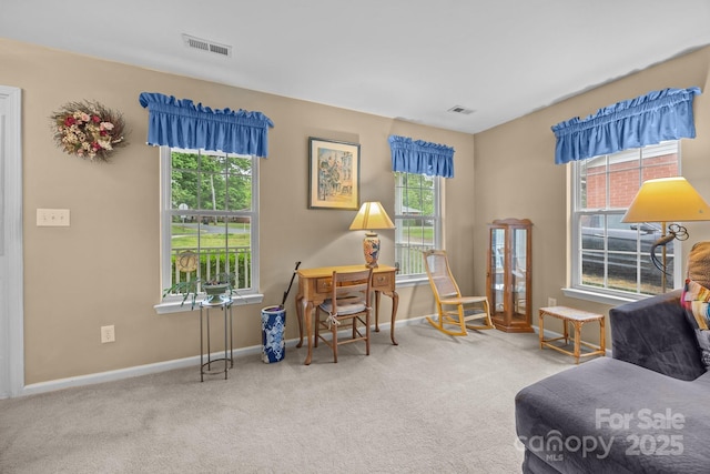 sitting room with visible vents, a healthy amount of sunlight, and carpet flooring