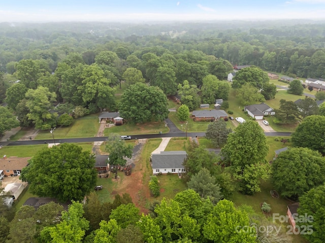 aerial view with a wooded view
